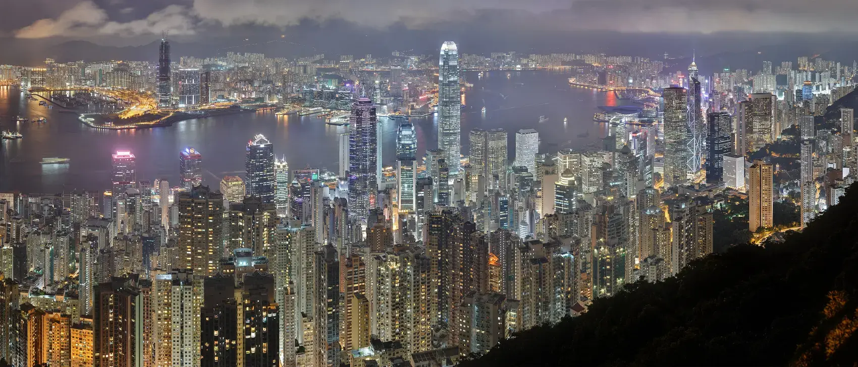 Hong Kong skyline and harbour seen from above at night